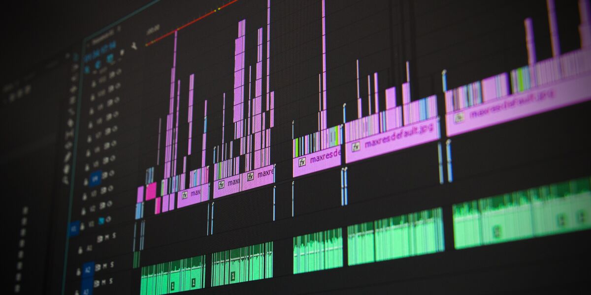 green and pink sound waves.