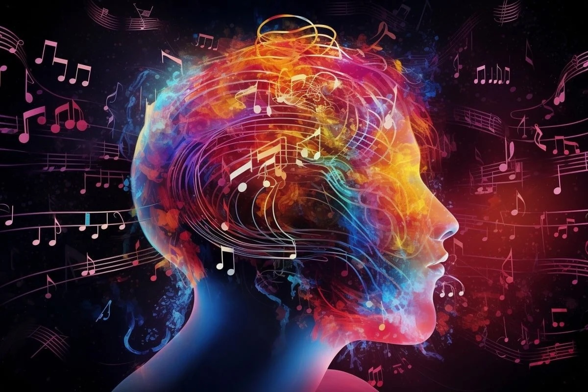 Illuminated face with music notes coming out of the brain.